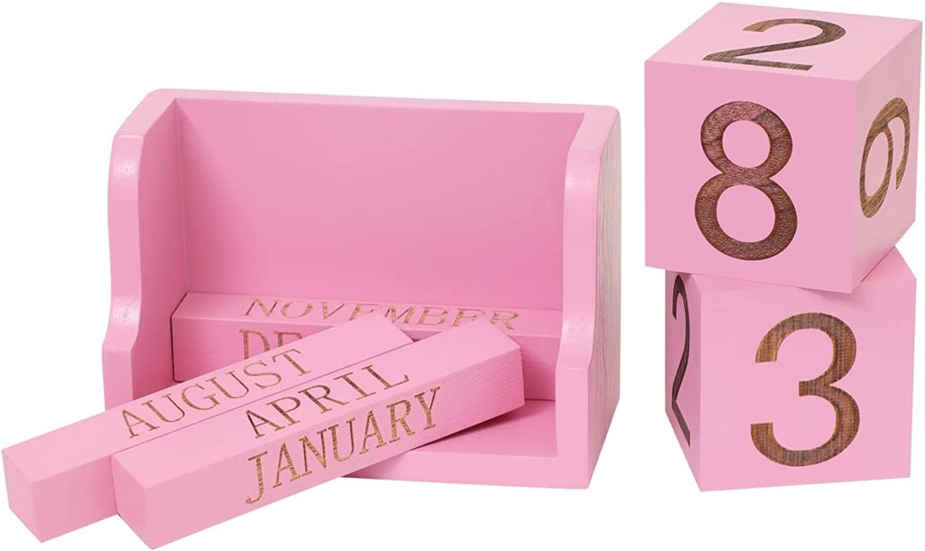Pink wooden blocks for a desk calendar.