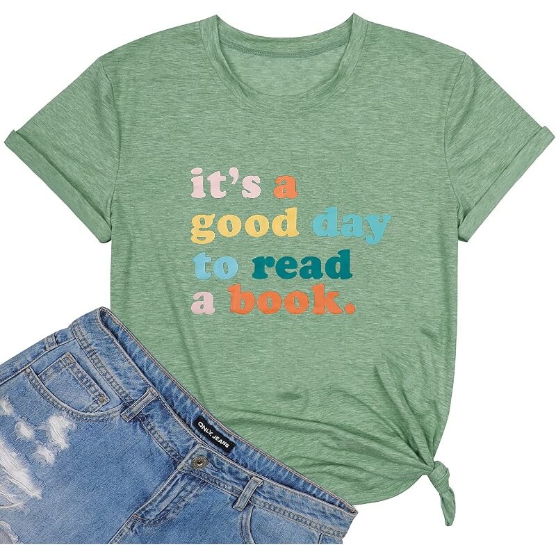 A green shirt featuring the saying "It's a good day to read a book." 