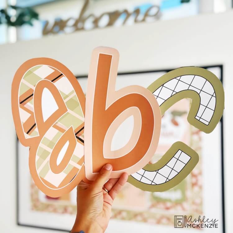 Modern Thanksgiving themed bulletin board letters. Lower case letters a, b, and c are being shown. The letters feature fall themed patterns and colors.