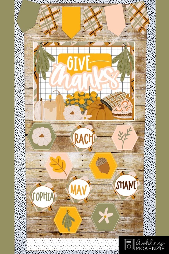 Modern Thanksgiving classroom door decorations featuring a sign that says "Give Thanks" and multiple decorative hexagons with student names on them.
