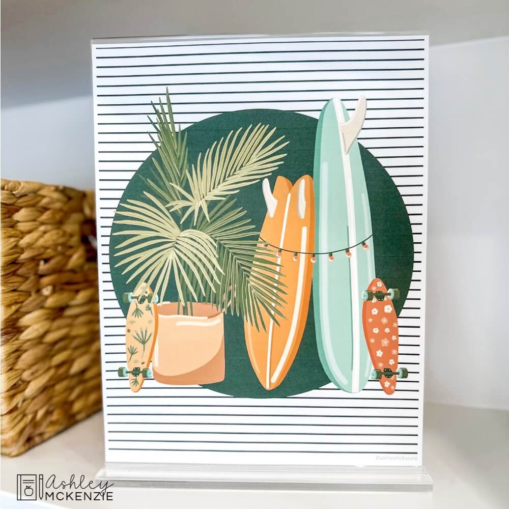 A poster displayed on a classroom bookshelf featuring palm fronds and colorful surf boards