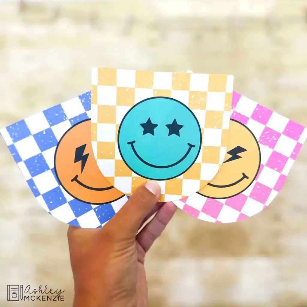 Banners for a bulletin board are shown featuring a checkered background an colorful smiley faces