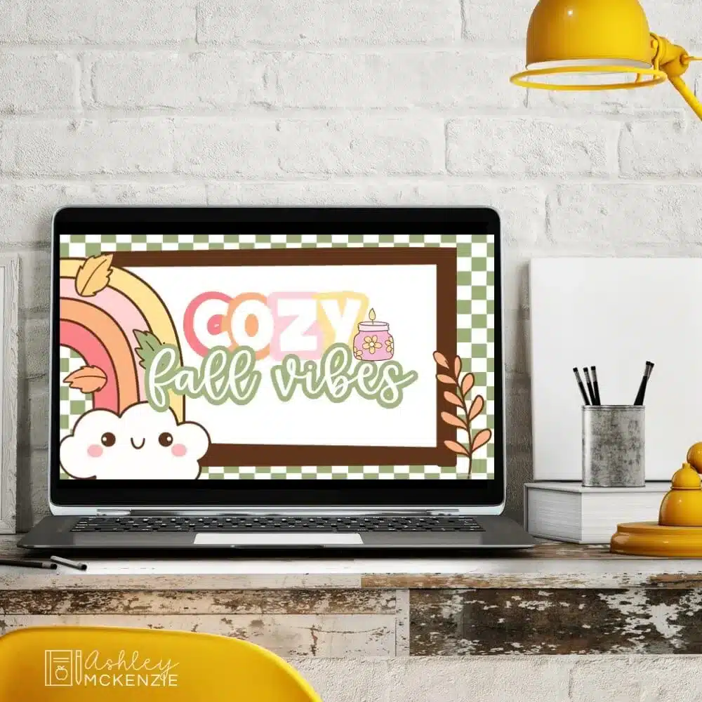 A computer showing Google Slides Templates that match fall classroom decorations and the saying "Cozy Fall Vibes"