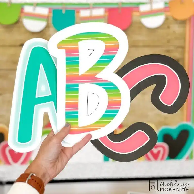 Brightly colored bulletin board letters are shown in a primary friendly font for back to school