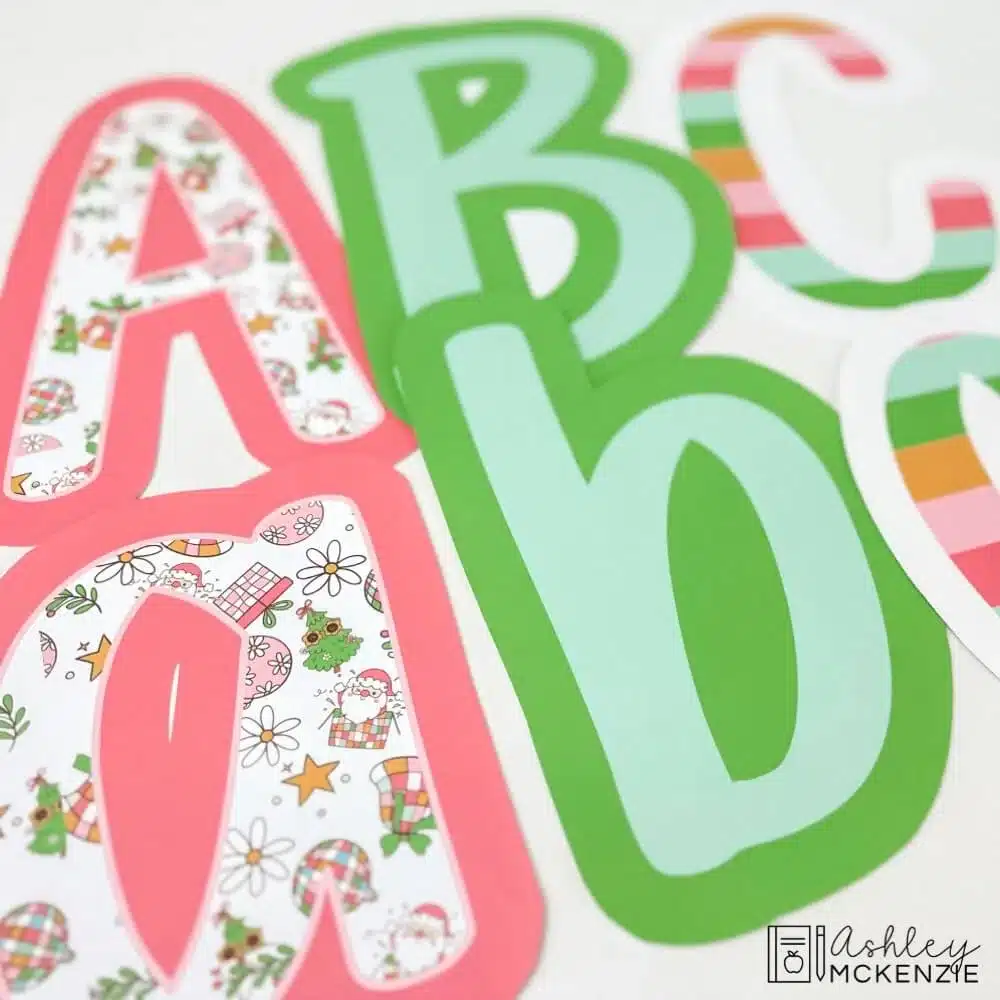 Cutouts of Christmas themed bulletin board letters in a primary friendly font