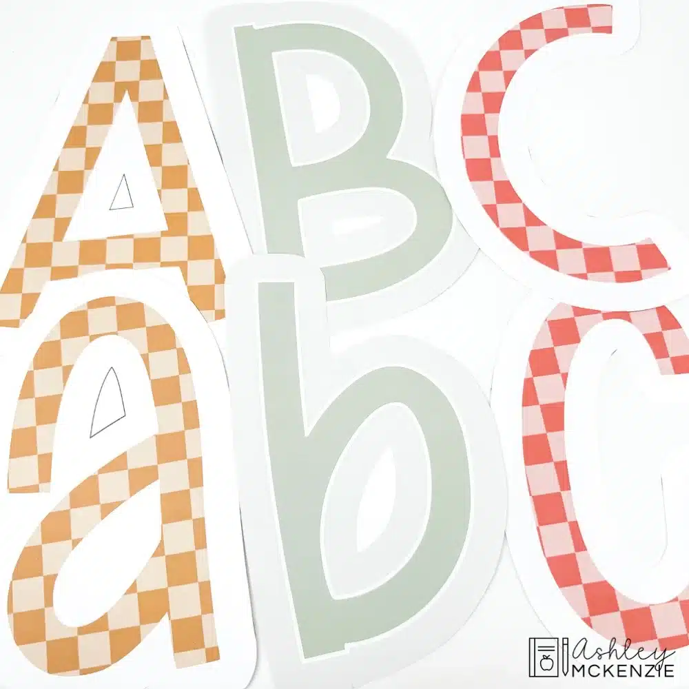 Upper and lowercase bulletin board letters a, b, and c are shown featuring checkered prints and warm colors.