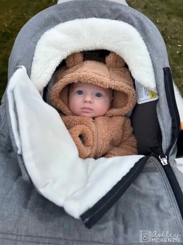 A baby bundled up for cold weather in a stroller