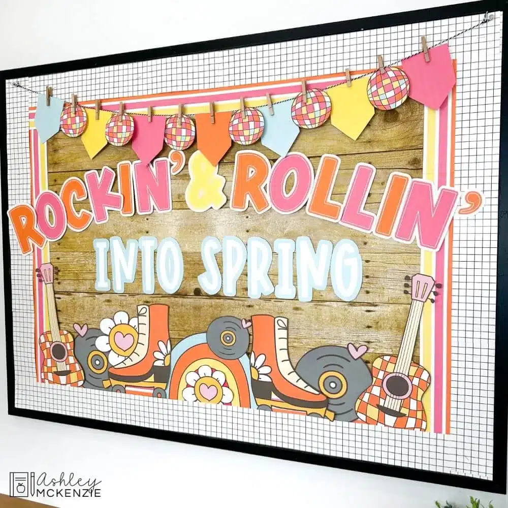 A spring bulletin board idea displayed in a classroom with the saying "Rockin and Rollin' into spring"