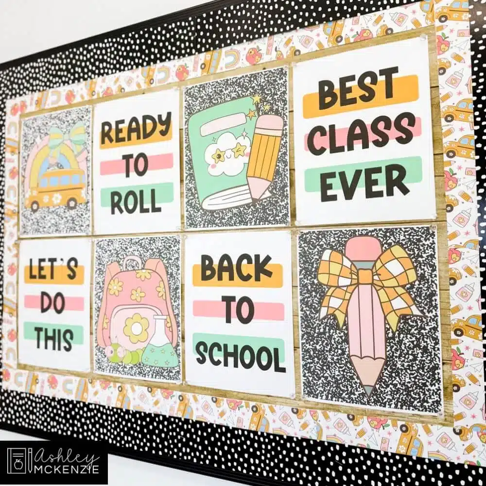 A classroom bulletin board decorated with colorful posters with upbeat sayings and cute school supply artwork