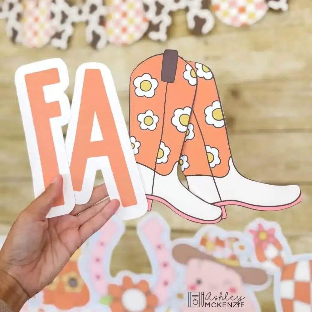 Printed bulletin board letters that spell the word "FALL" are shown, including 2 cowboy boots for the letter "L"