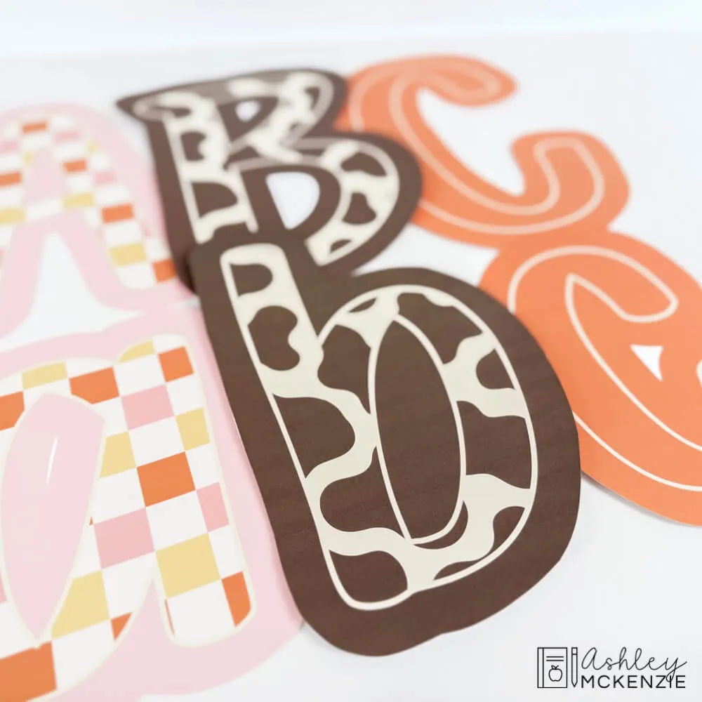 Fall bulletin board letters in a primary friendly font are shown featuring Western classroom theme prints and patterns.