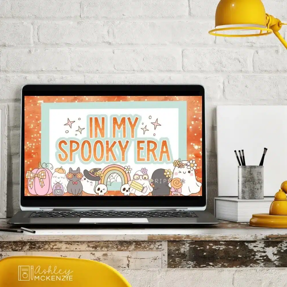 A teacher's computer displaying Halloween slide templates with a greeting slide that says "In my spooky era"