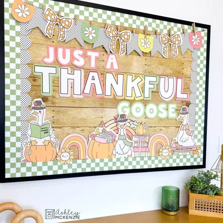 A November bulletin board decorated for Thanksgiving with the saying Just a Thankful Goose