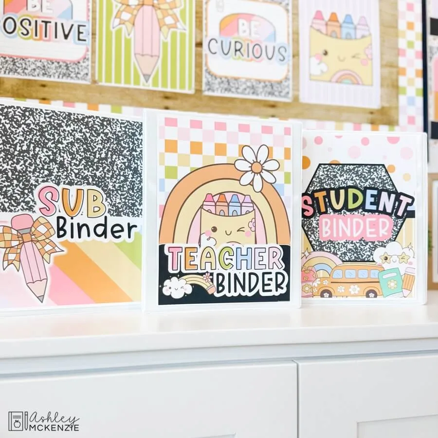 Teacher binders are displayed featuring coordinating binder covers that match the pastel classroom decor theme.