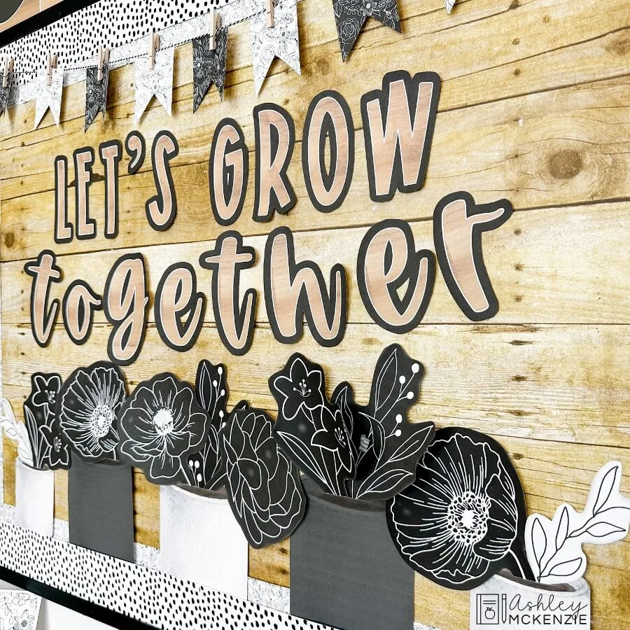 Black and white floral bulletin board kit featuring the saying "Let's Grow Together" for a growth mindset display